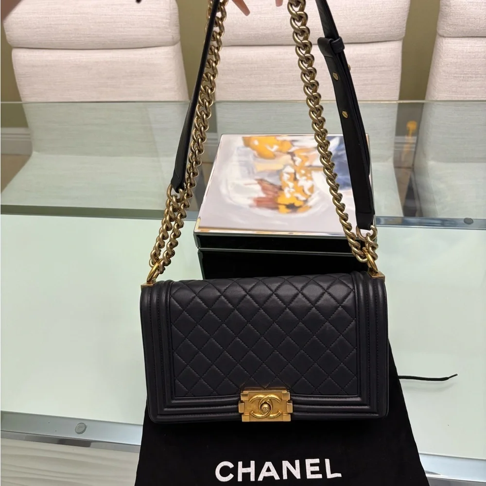 Authentic Chanel Quilted Médium Boy Flap Bag in Navy Blue